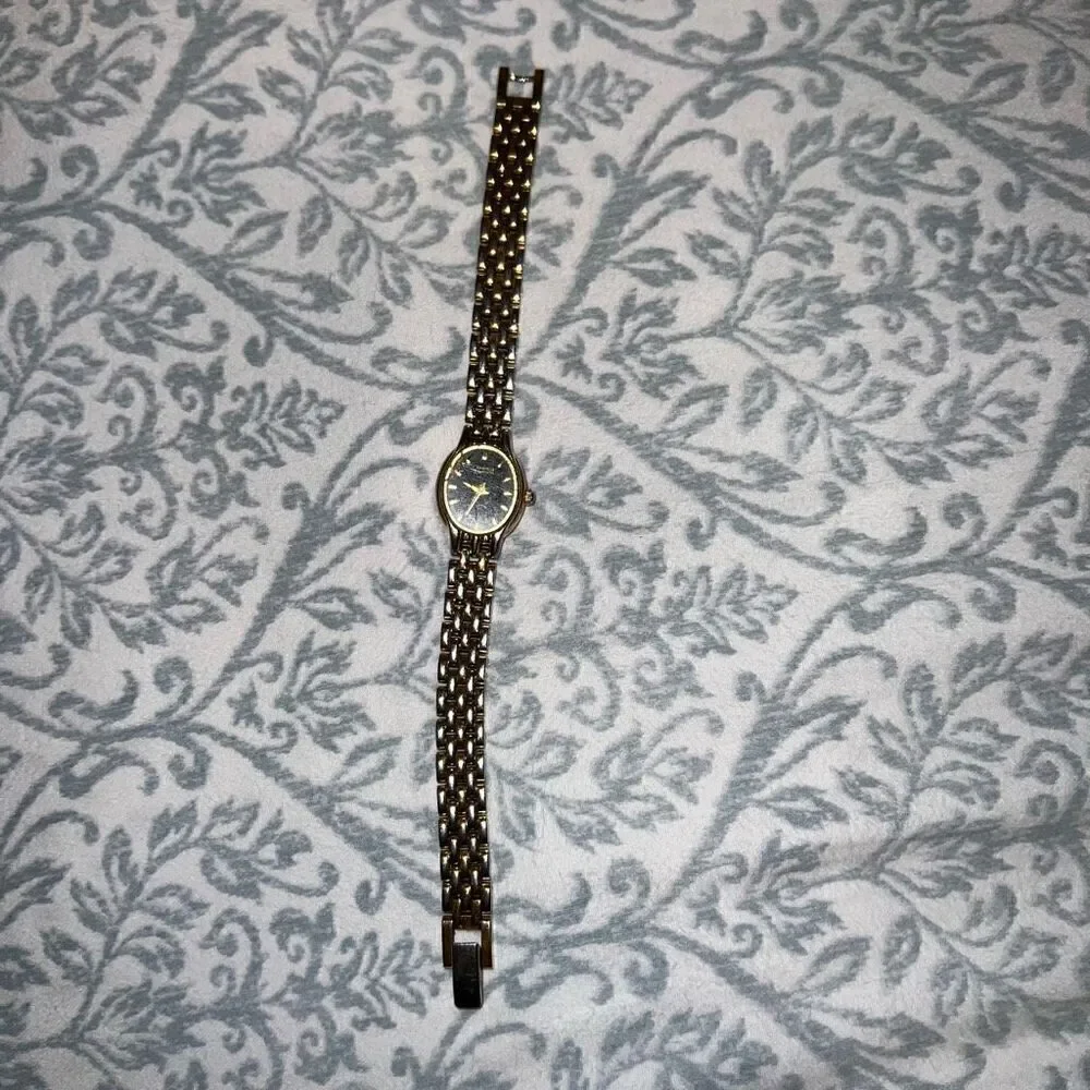 Bulova watch women’s style thin clock gold